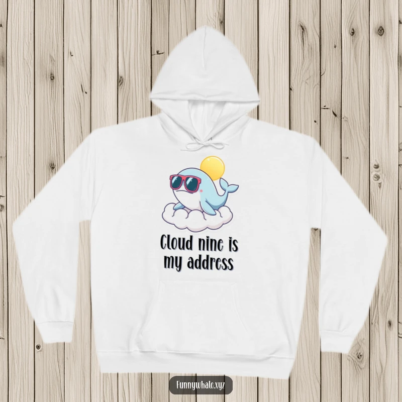 Funny whale wearing stylish oversized sunglasses on a soft, sunny cloud, perfect for a cozy and humorous hoodie.