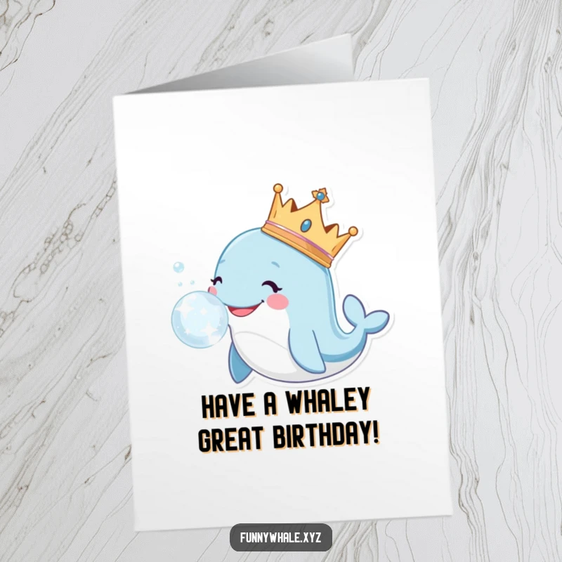 Funny Free Printable Birthday Card: Smiling whale wearing a crown, blowing a large, sparkling bubble with a regal air.